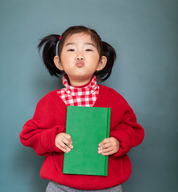 Cute Girl Holding a Book