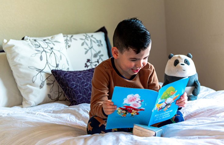 Boy-reading-on-bed